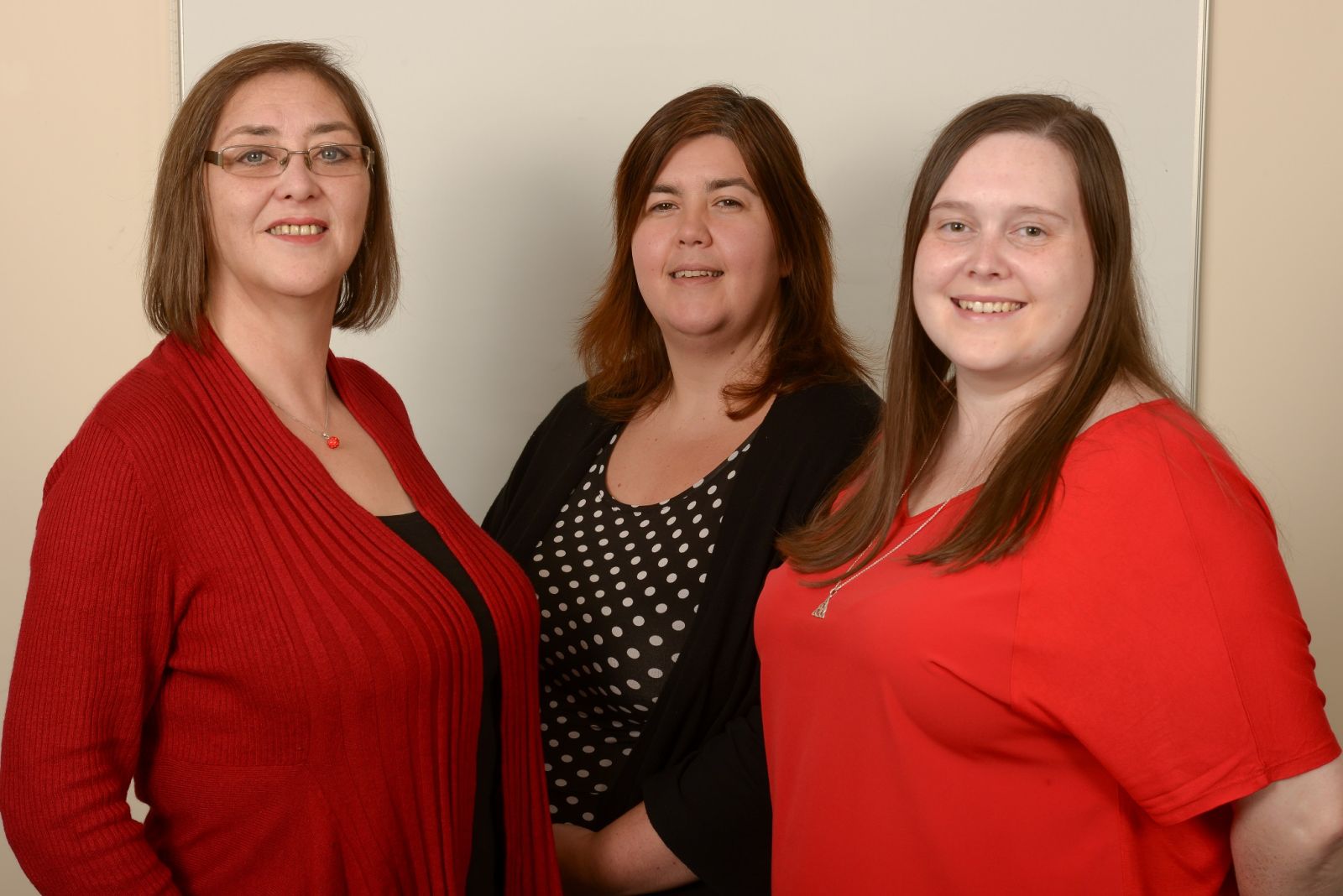An image of the Housing Management Team: three ladies smiling at the camera